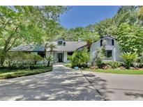 Charming single-story home with well-maintained landscaping and mature trees at 183 Parsons Rd, Longwood, FL 32779