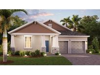 Charming one-story home featuring a two-car garage, manicured lawn, and welcoming front entrance at 1869 Clear Sky Dr, Kissimmee, FL 34744