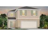 Charming two-story home featuring a two-car garage and traditional design elements at 3229 Ellsworth Ave, Davenport, FL 33837