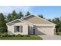 Charming single-story home featuring neutral paint, gabled roof, 2-car garage, and professionally landscaped front yard at 4309 Riverbend Blvd, Haines City, FL 33844