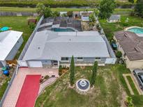 Lovely aerial view of the home featuring a pool, backyard, and unique stone and red brick driveway at 4021 Queen Anne Dr, Orlando, FL 32839