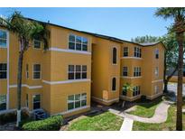 Lovely three-story building with well-maintained landscaping and ample natural light at 4528 Commander Dr # 2033, Orlando, FL 32822