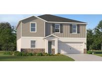 Charming two-story home featuring gray siding, a two-car garage, and a welcoming front entrance at 4701 Katrina Dr, Haines City, FL 33844