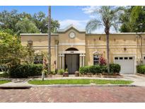 Charming single-story home with lush landscaping, palm trees, and a welcoming entrance at 548 S Hyer Ave # 1, Orlando, FL 32801