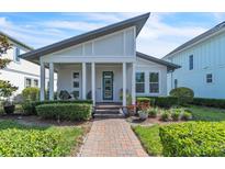 Charming single-story home featuring a modern design and well-manicured landscaping at 8518 Nemours Pkwy, Orlando, FL 32827