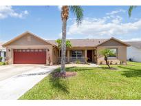 Charming single-story home features a well-manicured lawn and mature landscaping at 2407 Accord Ter, Kissimmee, FL 34758