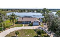 A charming single-story house is perfectly situated on a picturesque lakefront property, offering serene water views at 2562 Sheffield Dr, Deltona, FL 32738