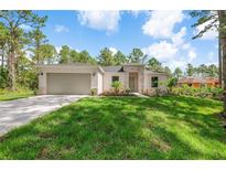 Charming single story home boasting a well-manicured lawn and attached two car garage at 30369 Apricot Ave, Eustis, FL 32736