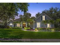 Charming single-Gathering home with lush landscaping and a well-manicured lawn, perfect for curb appeal at 8612 Summerville Pl, Orlando, FL 32819