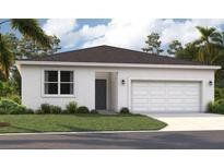 Charming single-story home featuring a stucco facade, well-manicured lawn, and attached one-car garage at 1323 Normandy Dr, Haines City, FL 33844