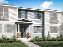 Charming two-story townhome with stone accents, landscaped front yard, and welcoming entryway at 1327 Tarflower Dr, Winter Springs, FL 32708
