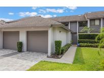 Charming townhome with a well-manicured lawn, attached garages and beautiful curb appeal at 148 Olive Tree Cir # 148, Altamonte Springs, FL 32714