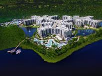 Stunning aerial view of resort-style condos with pools, lakes, and a pier at 15695 Grove Resort Ave # 4438, Winter Garden, FL 34787