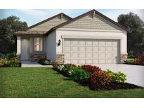 Charming single-story home with a neutral color palette, stone accents, and well-manicured landscaping at 2502 Linda Knoll Ln, Bartow, FL 33830
