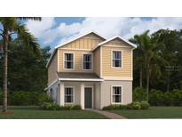 Charming two-story home with yellow siding and landscaped yard with palm trees at 2907 Transformation Way, Clermont, FL 34714