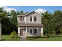 Charming two-story home featuring a covered porch, gray siding and manicured landscaping at 5984 Zen Way, Clermont, FL 34714