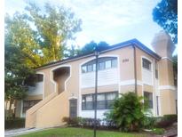 Inviting exterior of the home, surrounded by mature trees and well-maintained landscaping at 3124 S Semoran Blvd # 206, Orlando, FL 32822