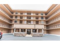Attractive multi-story building with stacked balconies and stone accents at the entrance at 3360 Ocean Shore Blvd # 4050, Ormond Beach, FL 32176