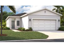 Charming one-story home featuring a well-maintained lawn, a two-car garage, and a modern design at 4125 Lavender Ct, Lake Hamilton, FL 33851