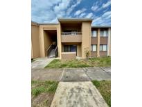 Two-story condominium with a second-floor balcony at 5269 Vineland Rd # 101, Orlando, FL 32811
