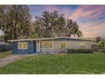 Charming single-story home with a well-manicured lawn and covered entryway at 826 Cherokee Cir, Sanford, FL 32773
