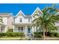 Charming two-story home with a well-maintained front yard and inviting curb appeal at 1222 Golden Canna Ln, Celebration, FL 34747