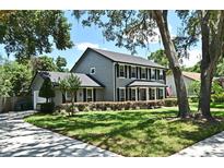 Charming two-story home with a well-manicured lawn and black shutters at 1462 Mt Laurel Dr, Winter Springs, FL 32708