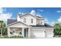 Charming two-story home featuring a two-car garage, stone accents and a bright teal front door at 1454 Pinecliff Dr, Apopka, FL 32703