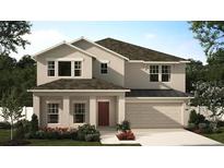 Charming two-story home featuring a neutral palette, well-manicured landscaping, attached two car garage and classic architectural details at 443 Lemongrass Rd, Minneola, FL 34715
