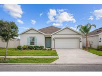 Charming single-story home with a two-car garage, well-maintained lawn, and appealing curb appeal at 601 Watusi Way, St Cloud, FL 34772