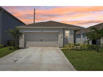Charming home with a two-car garage, landscaped yard, and freshly painted exterior, located on a quiet street at 4122 Sagefield Dr, St Cloud, FL 34773