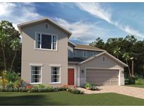 Charming two-story home showcasing a well-manicured lawn and a two-car garage at 6067 Vision Rd, St Cloud, FL 34771