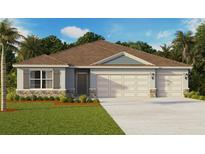 Charming one-story home with a three-car garage, stone accents, a well-manicured lawn, and professional landscaping at 1359 Morning Walk Dr, Ormond Beach, FL 32174