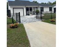 Charming single-story home with a manicured lawn and a freshly painted exterior at 1620 Hialeah St, Orlando, FL 32808