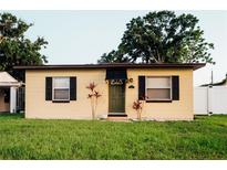 Charming single-story home featuring a well-maintained lawn and dark shutters at 920 Timor Ave, Orlando, FL 32804