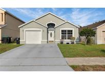 Charming single-Gathering home featuring a well-maintained lawn and a classic architectural design at 1429 Carey Glen Cir, Orlando, FL 32824