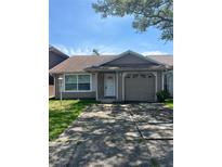 Charming single-story home with a well-maintained front yard and a one car garage at 1827 Blaine Ter, Winter Park, FL 32792
