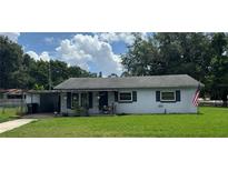 Charming single-story home with a well-maintained lawn and cozy front porch at 1975 Waldo St, Orlando, FL 32806