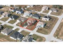 Aerial view showcasing the property's location within a residential neighborhood; neatly lined with paved roads at 2305 Rio Grande Forest Ln, Kissimmee, FL 34759