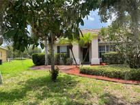 Charming single-story home featuring well-maintained landscaping and a welcoming front entrance at 4034 Bougainvillea Pl, Kissimmee, FL 34746
