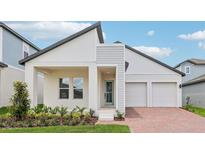 Charming single-Gathering home with a two-car garage, modern design, and well-maintained landscaping at 5308 Citrus Leaf Blvd, Winter Garden, FL 34787