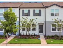 Charming townhouse with well-maintained lawn and manicured landscaping in a desirable community at 3335 Azolla St, Orlando, FL 32808