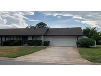 Single Gathering home with a 2 car garage and beautifully manicured landscaping at 1484 Magellan Cir # 403, Orlando, FL 32818