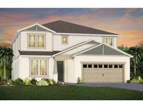 Beautiful new construction home with a two-car garage, verdant lawn, and manicured landscaping at 15053 Willow Ridge Dr, Montverde, FL 34756