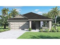 Charming one-story home with a well-manicured lawn, featuring a two-car garage and inviting front entrance at 223 Taylor Groves St, Lake Wales, FL 33898