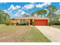 Charming single-story home featuring a well-maintained lawn, bright exterior, and a two-car garage at 2772 Pelham Cir, Deltona, FL 32738