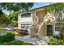 Charming condo building with well-maintained landscaping and private entrance at 2930 S Semoran Blvd # 408, Orlando, FL 32822