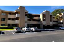 Condominium building with a well-maintained exterior and ample parking at 510 Cranes Way # 302, Altamonte Springs, FL 32701