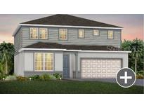 Charming two-story home with a gray exterior, well-manicured lawn, and attached two-car garage at 5518 Flame Vine Way, St Cloud, FL 34771