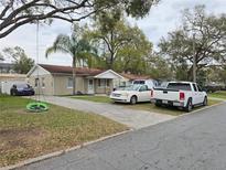 Charming single-story home featuring a welcoming front yard and a long private driveway at 864 E Lowell St, Lakeland, FL 33805